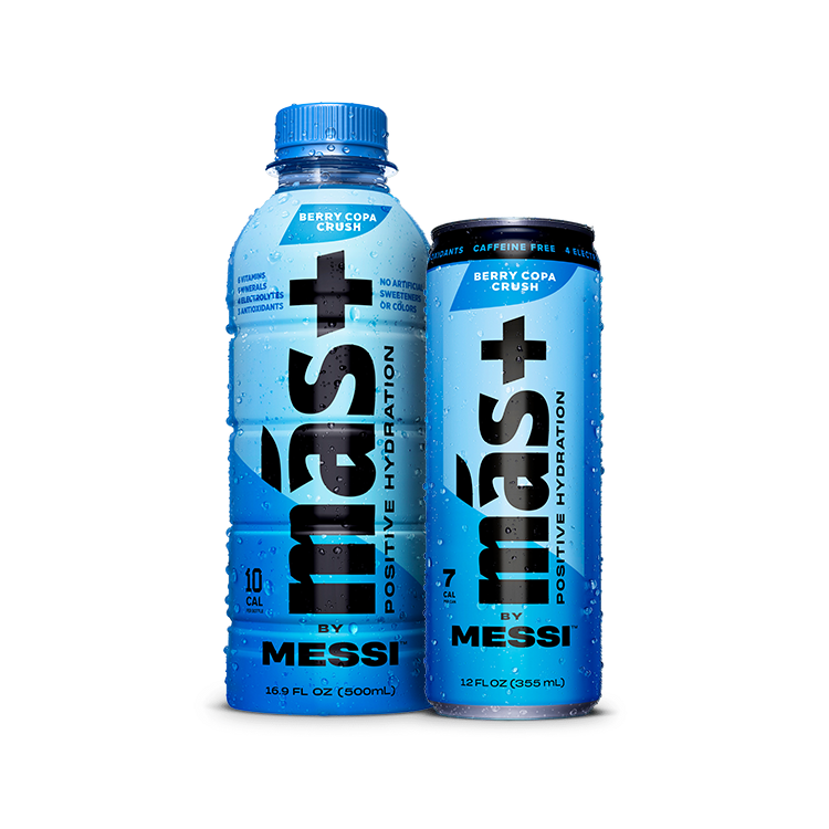 A blue 16.9 fl oz (500ml) plastic bottle and a blue 12 fl oz (355ml) aluminum can of "Más+ Positive Hydration by Messi" in the "Berry Copa Crush" flavor. The bottle has a screw cap, while the can has a sleek, slim design with condensation droplets. Both emphasize features like no artificial sweeteners, caffeine-free, and containing electrolytes and antioxidants. The background is transparent.